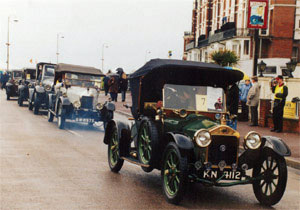 Vintage vehicles line up for a parade